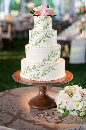 wedding cakes pictures white with green branches and flowers alexa stutts via instagram