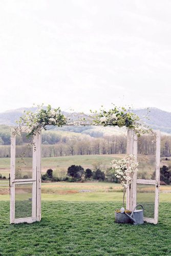old door wedding decoration country style wide doorway with white transparent doors decorated with white flowers adam barnes fine art photography