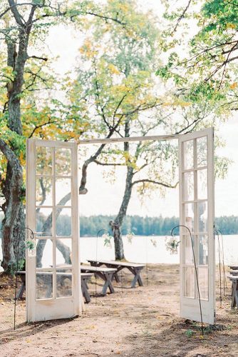 old door wedding decoration minimum adornments airy white doors with glass wedding on the river bank isabelle hesselberg via instagram