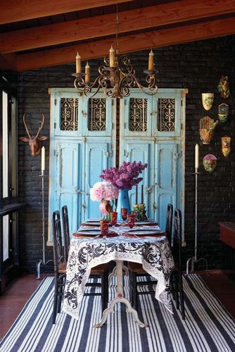 old door wedding decoration on a table a tablecloth with a pattern of chandeliers and ornaments on the walls joan somers design