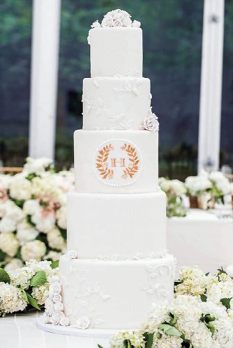 wedding monogram tall white cake with roses and monogram robert evans studios