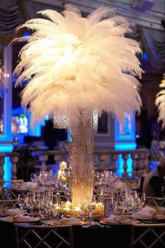 non floral wedding centerpieces lush white feathers in a high crystal vase rebecca weiss photography