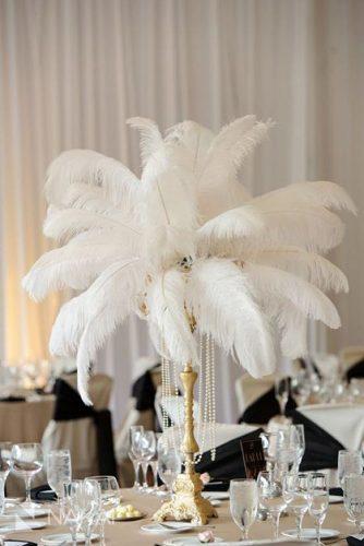 non floral wedding centerpieces on the golden stand white feathers and pearls nakai photography