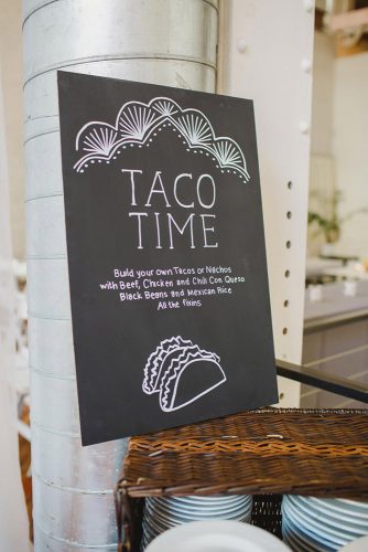 wedding taco bar black banner with an inscription and painted tacos shannon collins photography