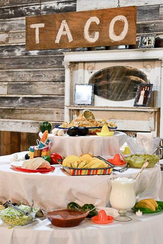 wedding taco bar decorated with mexican hats and wooden plaque white acresfarms