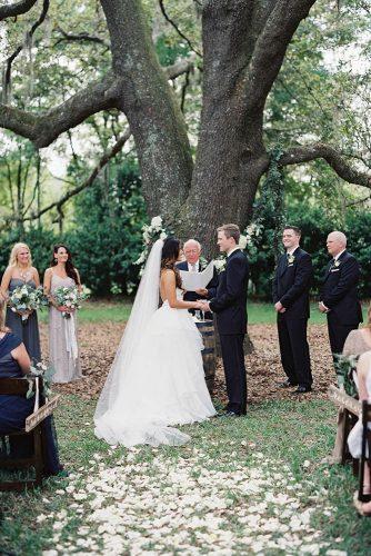 rustic wedding ceremony near tree laurenpeelephotography
