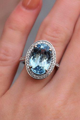 engagement ring trends aquamarine halo oval cut white gold
