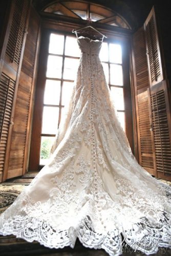 hanging wedding dress long tail back view benfield photography