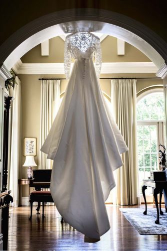 hanging wedding dress long tail back view elena mitchell photography