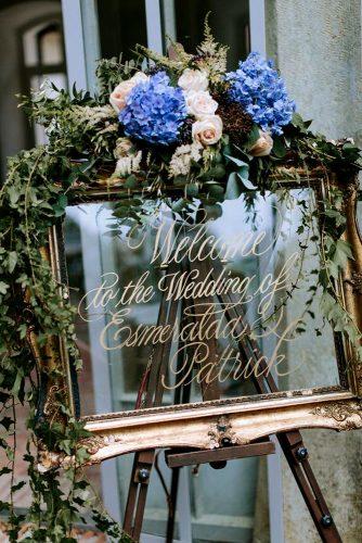 mirror wedding idea wedding sign with blue flower and greenery