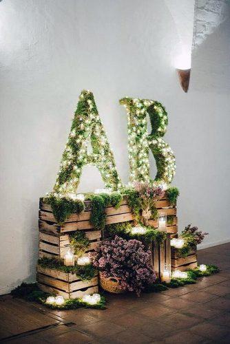 wooden crates wedding ideas boxes stand on top of each other decorated with flowers green and lights padilla rigau