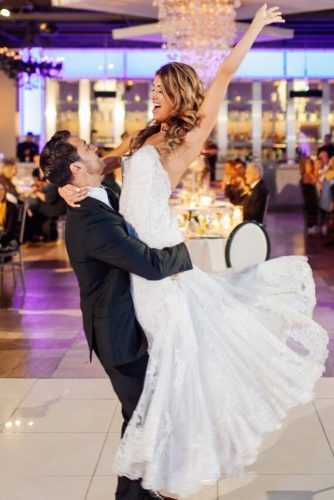 first dance wedding shots in grooms hands bride and groom carly goodrich via instagram