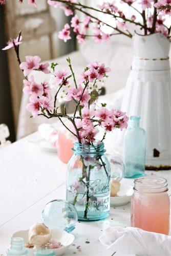 mason jars wedding centerpieces cherry blossom in blue glass dreamywhiteslifestyle via instagram