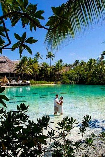best honeymoon spots ideas nice couple in water on amazing bora bora