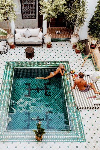 lovely honeymoon exotic spots couple relax in pool in marrakech