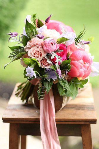 pink wedding bouquets with peonies roses and greens tied with a pink ribbon janet martineau via instagram