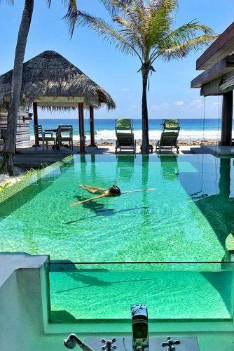 best honeymoon spots maldives hotel pool girl swims