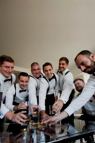 groomsmen photos ready with drink camelot photography studios
