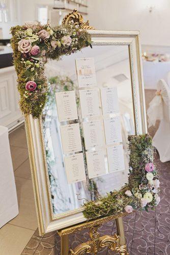 mirror wedding ideas table setting in gold frame decorated with moss and roses tracy weston photography