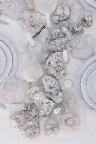non floral wedding centerpieces nautical gray geode and candles on the table the lane via instagram