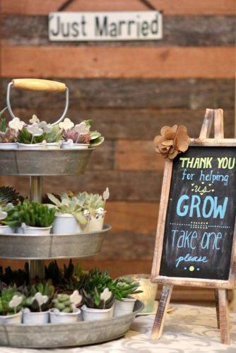 rustic barbecue bbq wedding a metal stand with succulents and warm words about love for guests andy sams photography