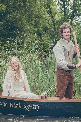 themed wedding photos the lord of the rings bride and groom in a boat there and back again elina photography