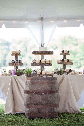 wine barrels dessert table stand made of wooden slices with cake on the barrel 1326 studios