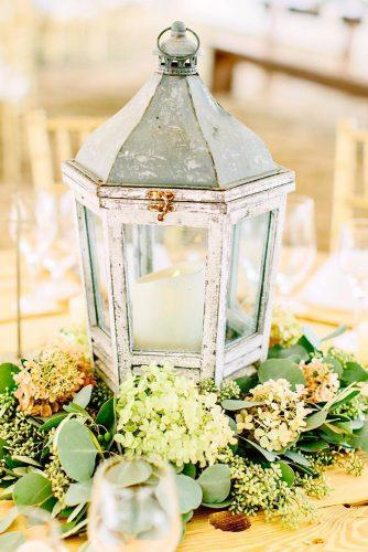 lantern wedding centerpiece ideas lantren with green flower kellydillonphotography