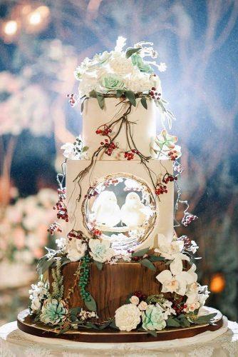 woodland themed wedding cakes white with flowers berriaes and two birds lenovelle cake bali via instagram
