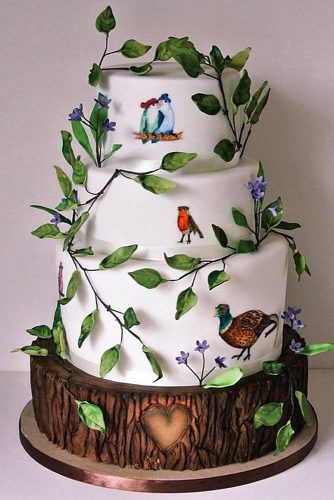 woodland themed wedding cakes white with forest birds green leaves and a heart happy hills cakes