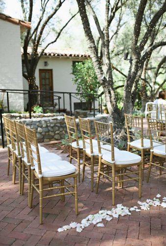 gold wedding decorations gold chair in wedding alise Adrienne Gunde Photography
