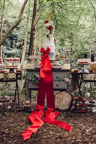 rustic backyard wedding decoration dessert table with cake with red ribbons chloeleephoto via instagram