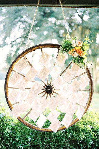 rustic backyard wedding decoration escort card display on a wheel hunter ryan photo