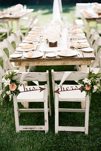 rustic backyard wedding decoration light wooden table and chairs with flowers and inscriptions clayton austin