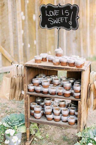 rustic barbecue bbq wedding wooden old cabinet with treats and paper bags juicebeats photography via instagram