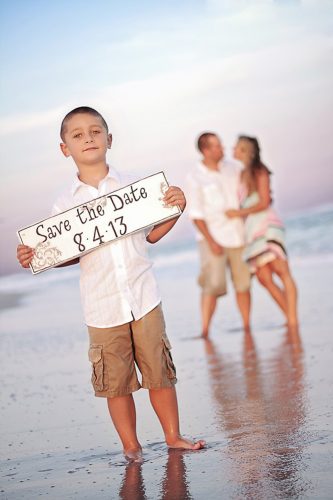 save the date photo ideas with boy on a beach melissa calise photography