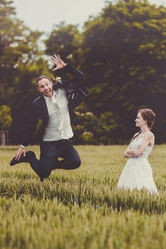 wedding entourage photo ideas bride and groom jump field photographer jaromir zubak