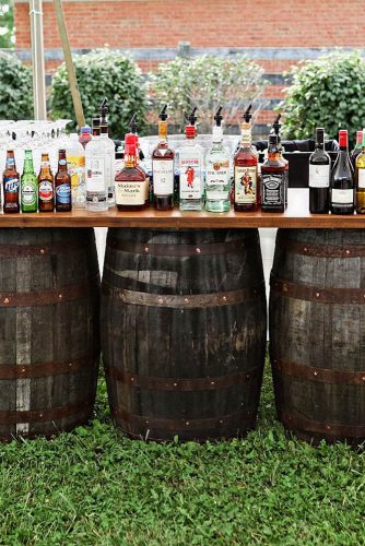wine barrels wooden bar with drinks on barrels weddings via instagram
