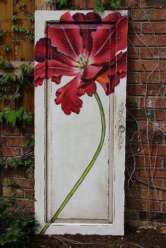 old door wedding decoration door with a painted red flower sophies place via flickr