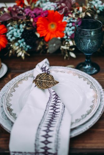 on a table with flowers a plate with indian patterns lorena erre photography