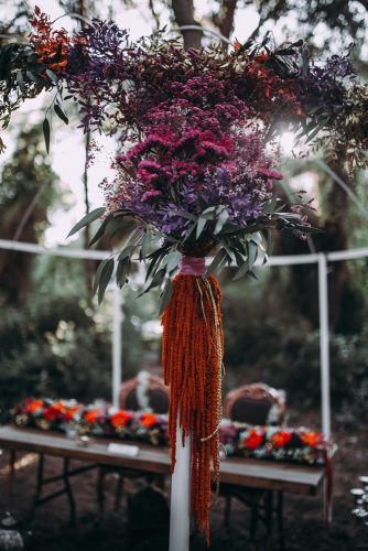 pink lilac and orange exotic flowers decorate the arbor lorena erre photography