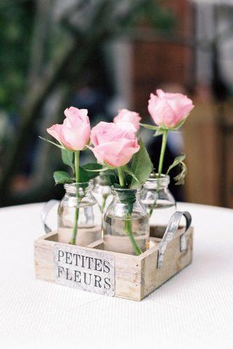 rustic backyard wedding decoration pink roses in glass jars in wooden box lucy davenport