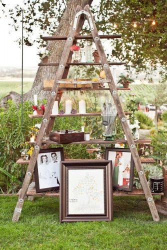 rustic backyard wedding decoration wooden ladder with flowers and photos joyful weddings and events