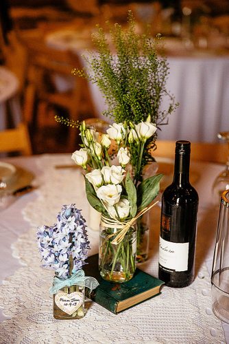 western wedding decoration white and sevenvene flowers in cans on the book cassandra lane photography