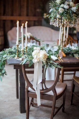 western wedding decoration wooden table with flowers greenery and candles conforti photography llc