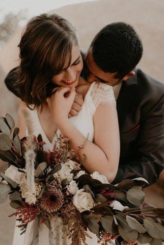 couple poses couple with bouquet peytonrbyford