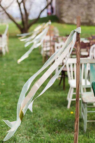 hippie wedding aisle decorated with white ribbon ashley bartoletti photography