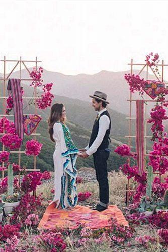 hippie wedding ceremony outdoor with pink flowers farhad samari
