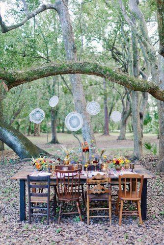 hippie wedding recepdion with lace in wood on the table flowers and woven tablecloths andi mans photography