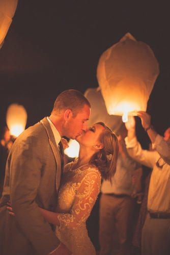 sky lanterns romantic kiss bride and groom city light studio
